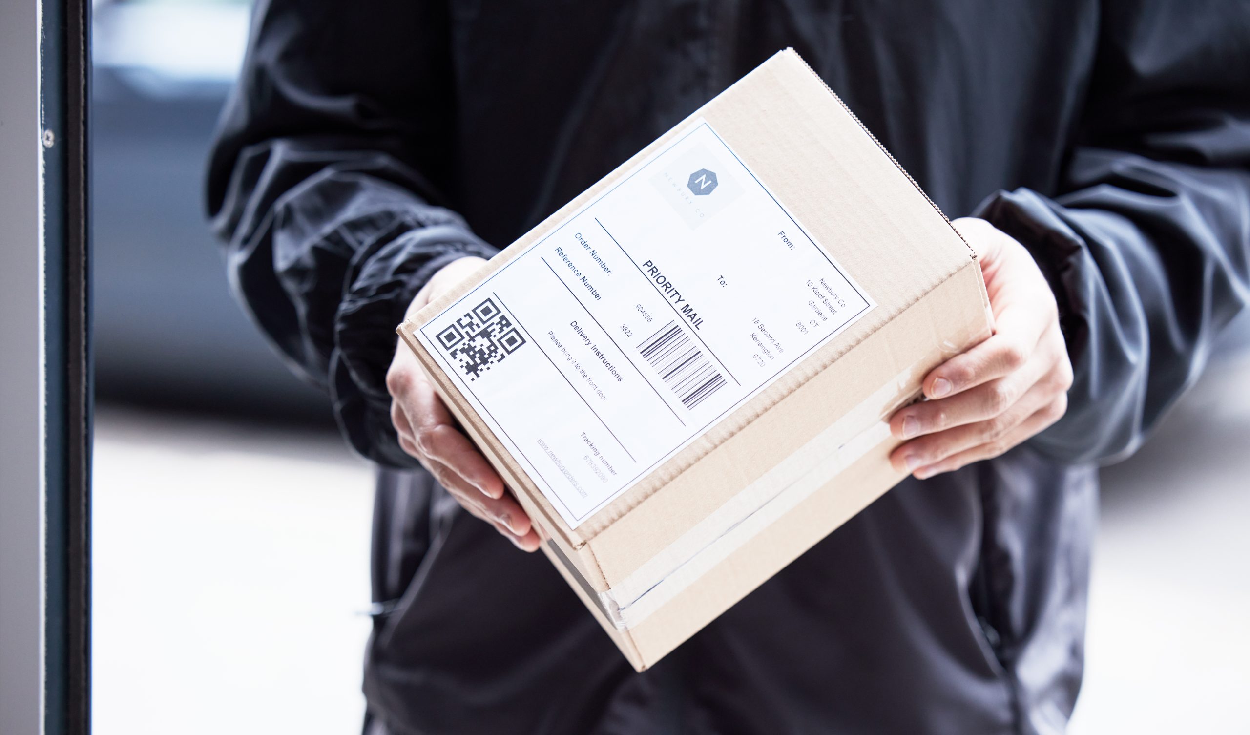 box-hands-and-courier-at-with-mail-for-a-delivery-2023-11-27-05-08-06-utc Box, hands and courier at with mail for a delivery, ecommerce work or cargo shipping. Closeup, logi.