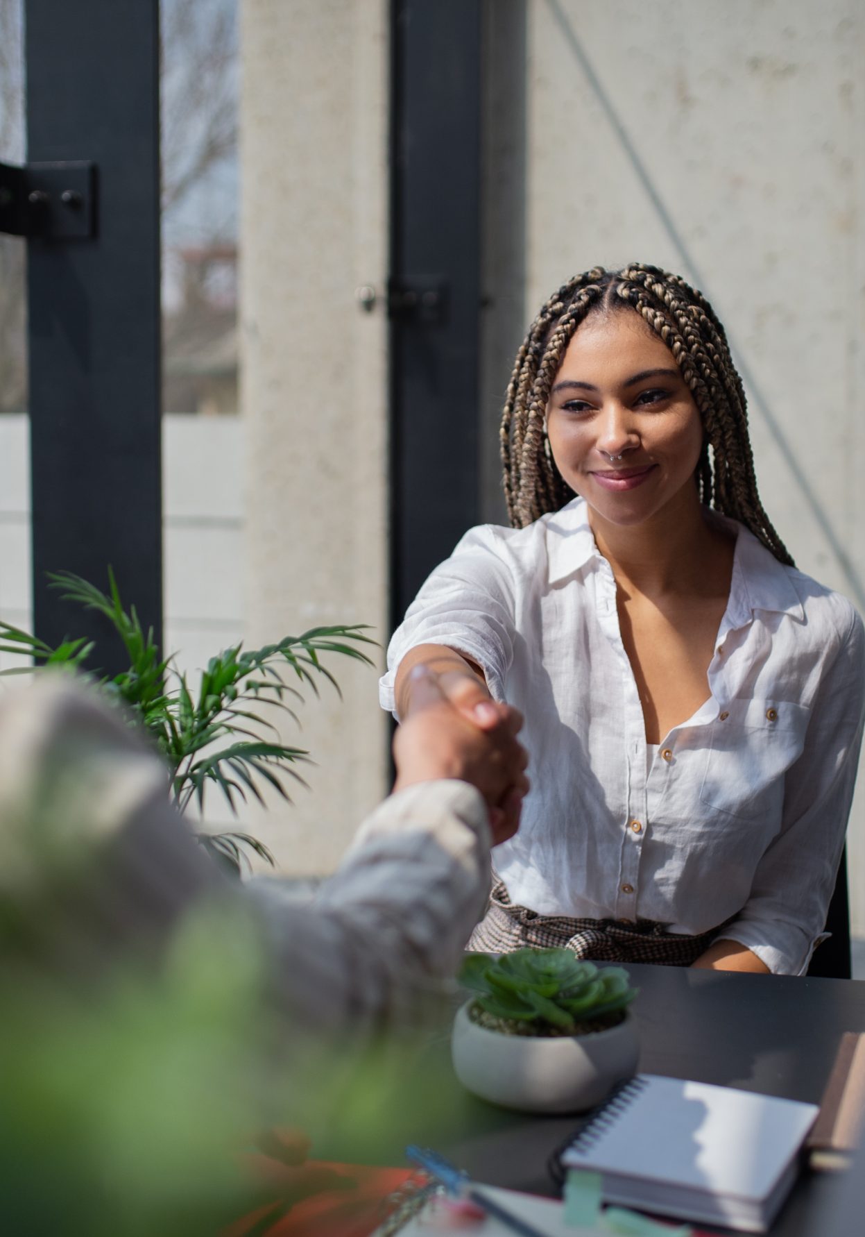 A happy young woman having job interview in office, business and career concept.